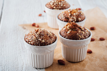 Homemade banana peanut muffins in ceramic baking form