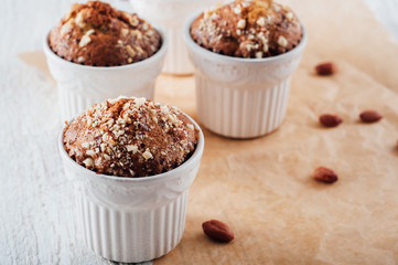 Homemade banana peanut muffins in ceramic baking form