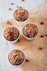 Homemade banana peanut muffins in ceramic baking form