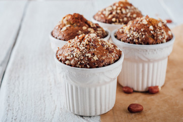 Homemade banana peanut muffins in ceramic baking form