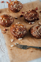 Homemade banana peanut muffins on baking paper