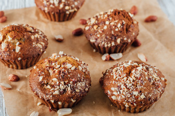 Homemade banana peanut muffins on baking paper
