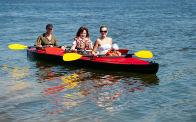 People of all ages in a kayak. Family holiday.