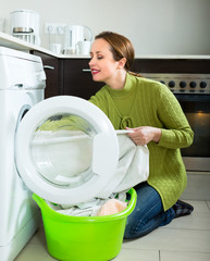 Attractive woman doing laundry