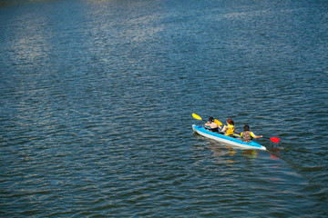 Young people in canoes. Family holiday.