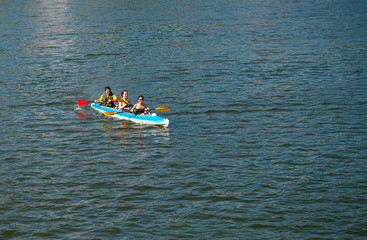 Young people in canoes. Family holiday.