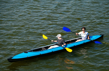 Fototapeta premium Young people in canoes. Family holiday.