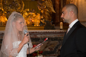 Bride and groom during church wedding ceremony