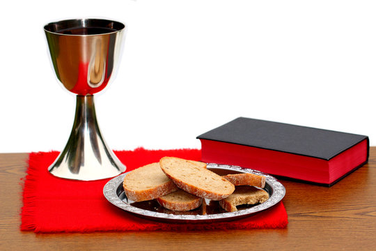 Silver Chalice With Bread And Bible