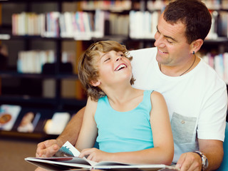 Father with son in library