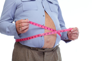 Fat man measuring his big stomack.