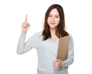 Young woman hold with clipboard and finger up