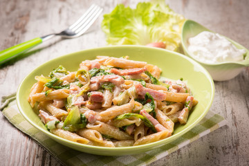 pasta with bacon lettuce and cream sauce, selective focus