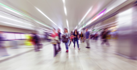 colorful people on busy street in motion,