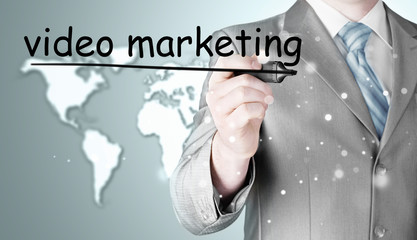 business man writing Video Marketing