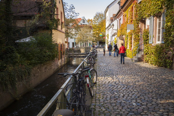Old town street with canal in Freiburg