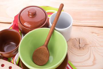 plates and cups on wooden table