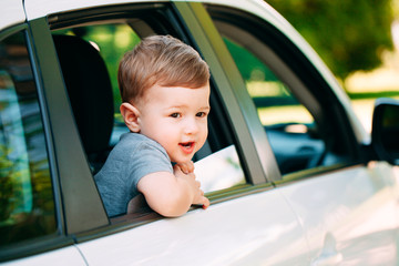 Adorable baby boy in the car