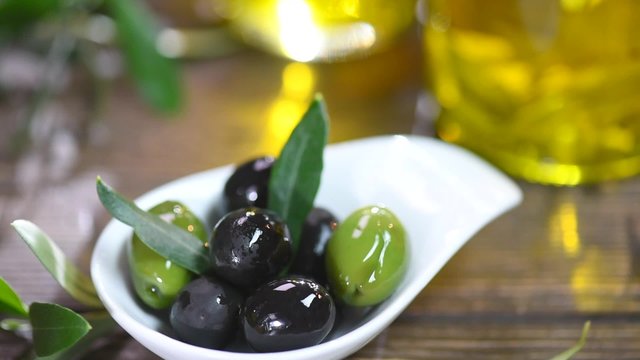 Olives and olive oil. Extra virgin olive oil in bottles