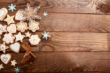 Christmas cookies on brown wooden background. Top view