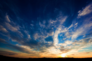 Dramatic sunset sky over Tuscany hills, Italy.