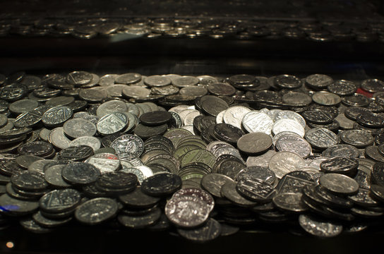 lots of money and coins in arcade machine