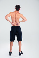 Fototapeta premium Athletic man having back pain
