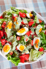 Summer salad with tomatos and boiled eggs