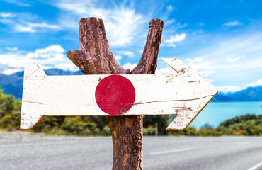 Japan Flag wooden sign with road background