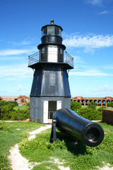 Fort Jefferson lighthouse and Cannon with Fort walls and courtyard in the background, Dry Tortugas,...