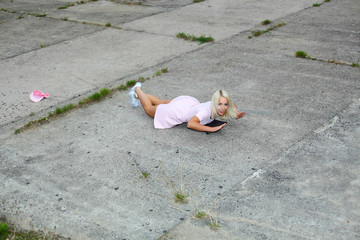 Beautiful fashionable sexy girl having fun on a skateboard.