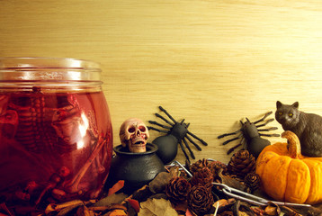 spooky halloween object on wood background.