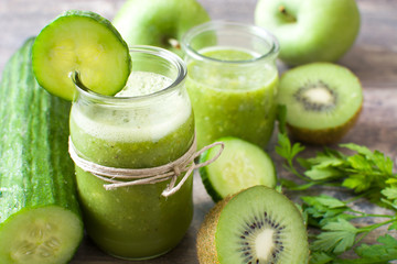 Fototapeta na wymiar Green smoothie with cucumber, apples and kiwi