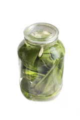 Pickles in a jar on a white background