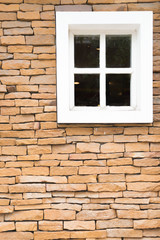 window at stone wall made with blocks