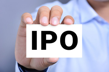 IPO letters on the card held by a man hand