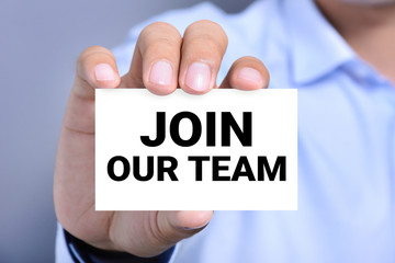 JOIN OUR TEAM, message on the card held by a man hand