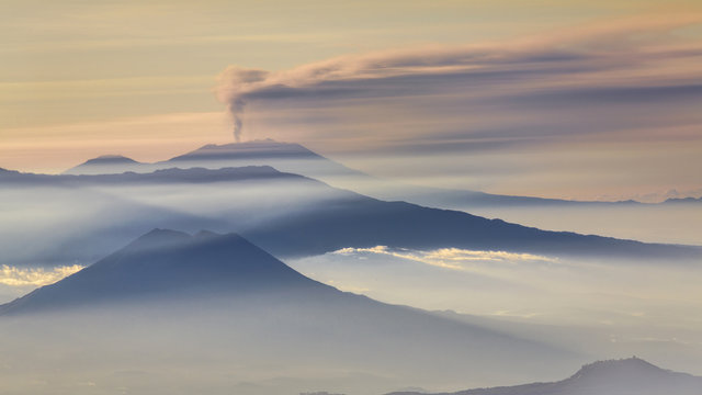 Mountain range and Active Volcano at dawn, East Java, Indonesia
