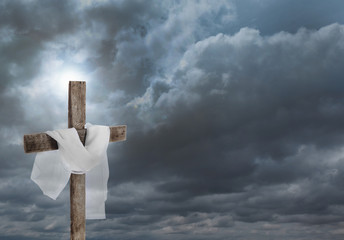 Cross with cloth on sky background