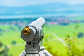 Image of a telescope overlooking for rural landscape