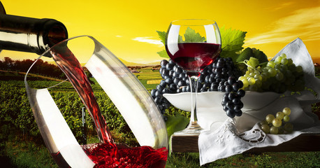 Glasses with red wine in a vineyard