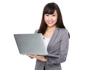 Asian Young businesswoman use of the notebook computer