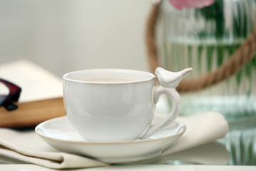 Obraz na płótnie Canvas Cup of coffee on table close up