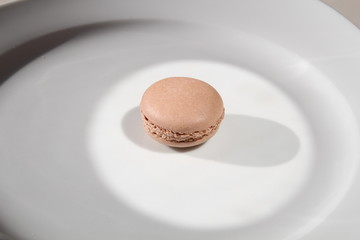 French brown macarons on hell background 