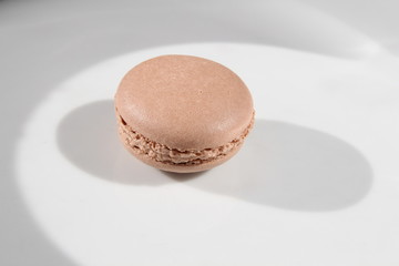 French brown macarons on hell background 