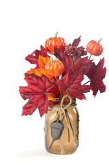 Fall Leaves and pumpkins arrangement in a mason jar