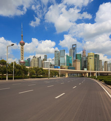 Fototapeta na wymiar Empty road surface with shanghai bund city buildings