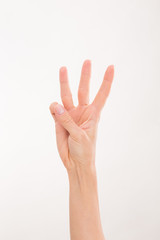 Woman's hand representing three fingers