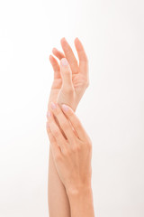 Two woman's hands demonstrating skincare