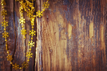 New Year's background with a garland and wooden texture
